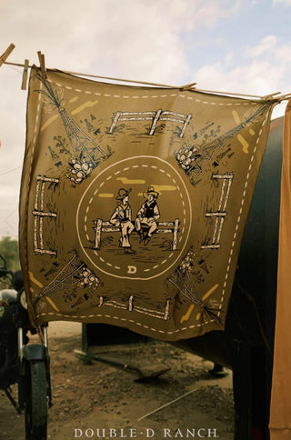 Olive green silk scarf featuring two cowboys sitting on a fence, oil derricks, and floral motifs.