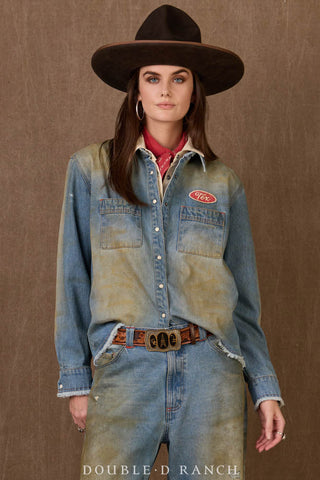 Distressed light blue denim workshirt with "Tex" patch, frayed hem, snap buttons, and dual chest pockets.