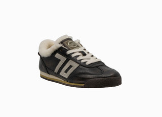 Leon W26 Sneaker in black leather with shearling lining, cream laces, and gray "70" side detail.