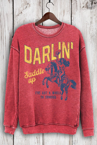 Red mineral wash crewneck sweatshirt with vintage cowgirl graphic and "Darlin' Saddle Up" text print.
