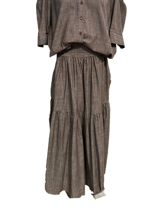 Taupe linen tiered maxi skirt with smocked elastic waistband, flowing gathered silhouette, midi length.