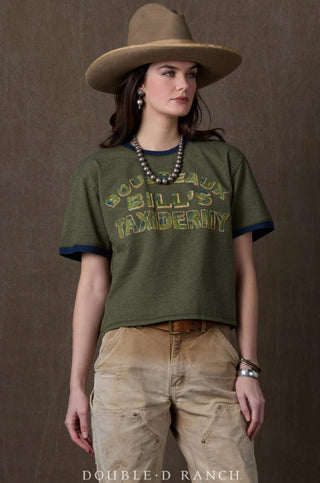 Olive green cropped ringer tee with distressed "Boudreaux Bill's Taxidermy" graphic print and navy blue trim.