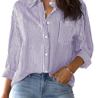 Purple and white vertical striped button-down shirt with chest pocket, long sleeves, and collared neckline.