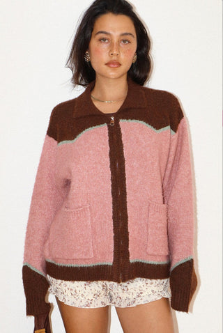 Pink and brown colorblock zip-up knit cardigan with mint trim, collar, and front pockets.
