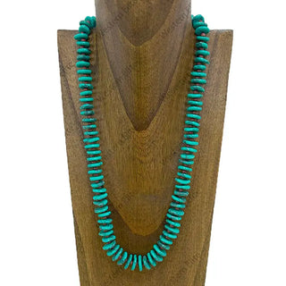 28-inch green turquoise flat stone chip necklace with brown sequin beads displayed on wooden bust.