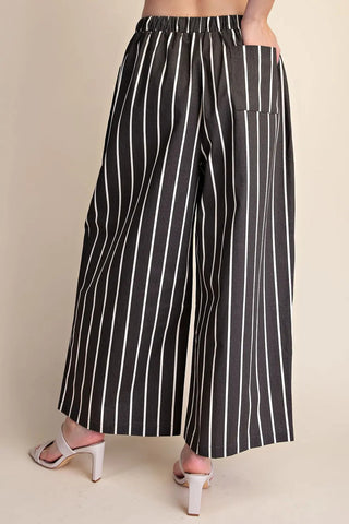 Black and white vertical striped wide leg pants with elastic waistband and back patch pocket.