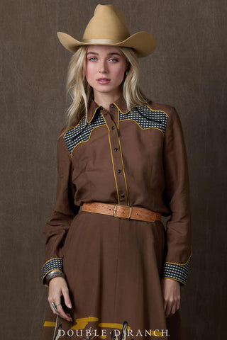 Brown western shirt with checkered yoke panels, gold piping trim, snap buttons, and matching cuffs.