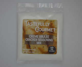 Small clear plastic packet of Tastefully Gourmet Crème Brulée Cracker Seasoning Mix containing white powder, 12 servings.