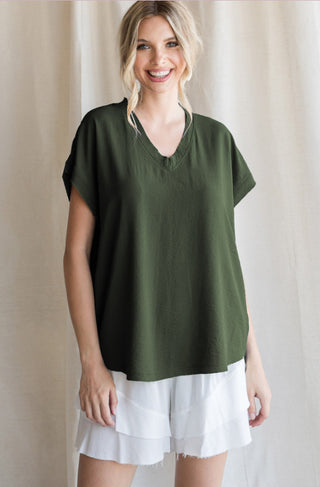 Solid top with short cap sleeves and raw edge hems
