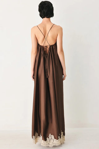 Truffle brown satin midi slip dress with criss-cross back straps, lace hem trim, and tassel tie detail.