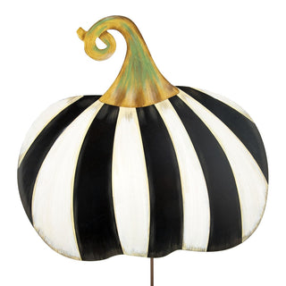 Decorative black and white striped pumpkin with gold stem and curling green tendril on metal stake.