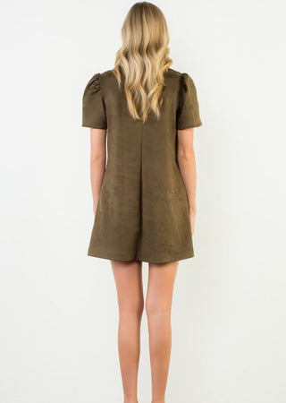 Olive green short sleeve suede mini dress with puff sleeves and A-line silhouette, back view.