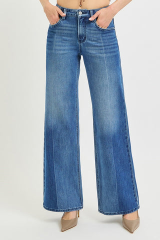 Medium blue wash high rise wide leg jeans with two-tone fading and front crease detail.