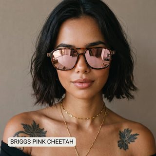 Woman wearing Briggs polarized aviator sunglasses with tortoise cheetah frames and pink mirrored lenses.