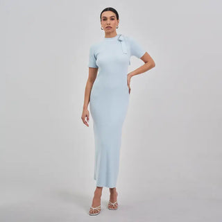 Light blue ribbed knit midi dress with tie neck detail, short sleeves, and form-fitting silhouette.