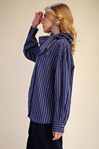 Navy blue and white striped oversized shirt with high neck bow tie detail and button cuffs.