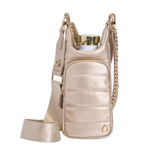 Soft gold vegan leather quilted water bottle carrier bag with gold chain strap and wide crossbody strap.
