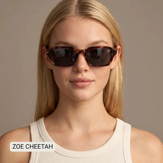 Rectangular tortoiseshell sunglasses with dark lenses and brown cheetah-print acetate frames on a female model.