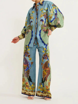 Teal blue peacock and floral print matching set with billowy long sleeves and wide-leg pants.