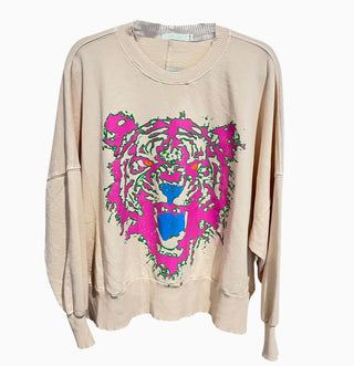Cream oversized French terry sweatshirt featuring a bold neon pink, green, and blue roaring tiger face graphic.