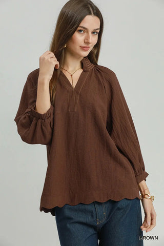 Brown scallop hem balloon sleeve blouse with V-neckline, raglan sleeves, and contrast stitching detail.