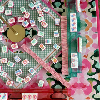 Pink and green floral Mahjong Mat Royal Garden with tiles and racks arranged on playing surface.