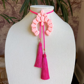 Blush pink beaded naja pendant bolo necklace with neon pink cord and fuchsia tassel drops