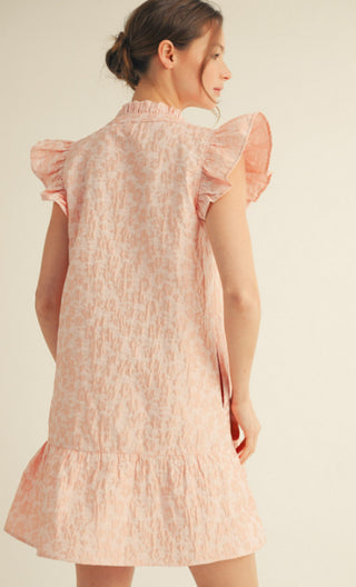 Pink floral print mini dress with ruffled cap sleeves, mock neck, and tiered ruffle hem.