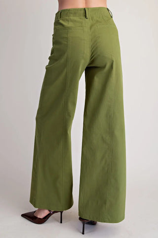 Olive green wide-leg pants with high waist seam stitching, back patch pockets, paired with brown heels.