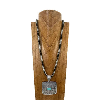 33-inch silver Navajo pearl roundel bead necklace with engraved square metal pendant featuring turquoise stone centerpiece.