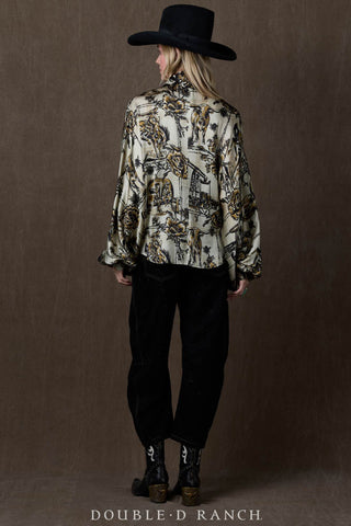 Cream and gold western toile print satin blouse with wide sleeves, styled with black jeans and boots.