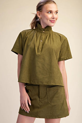 Olive green suede-texture stand collar pullover shirt with gold snap buttons and short sleeves.