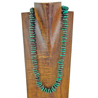 23-inch dark green flat turquoise stone disc bead necklace with small red accent beads on wooden display bust.