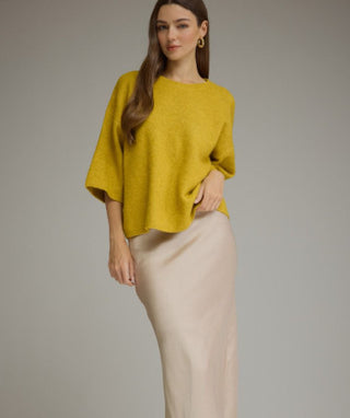 Solid ¾ sleeve sweater top featuring a round neck and ribbed trim