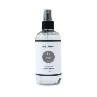 Clear glass spray bottle of Mixture No. 14 Black Pepper Freshening Room Mist, 8 fl oz, with black pump top and white label.