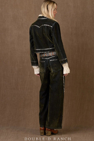 Dark green studded denim jacket with silver dot trim, worn with matching pants and decorative belt.