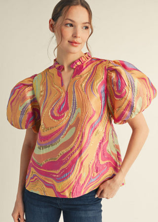 Multicolor abstract swirl jacquard top with voluminous puff sleeves and ruffled mock neckline.