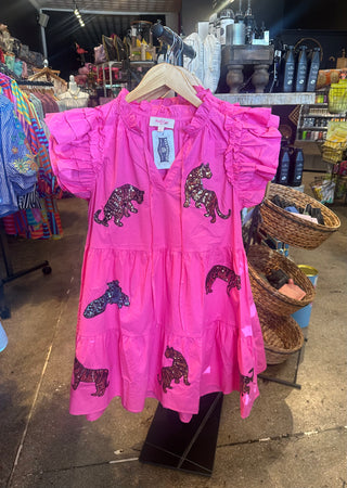 Hot pink tiered ruffle-sleeve mini dress with sequined tiger embroidery patches throughout, displayed on hanger.