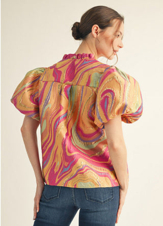 Colorful abstract swirl jacquard top with short puff sleeves and ruffled neckline, pink orange multicolor.