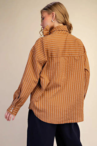 Camel brown and white striped oversized button-down shirt with high neck bow detail, long sleeves.