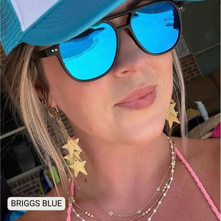 Woman wearing Briggs blue mirrored polarized aviator sunglasses with black frames and a teal trucker hat.