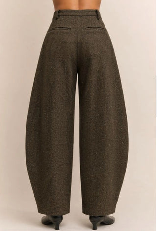 Brown herringbone high-waist barrel leg pants shown from behind, featuring wide curved silhouette and belt loops.