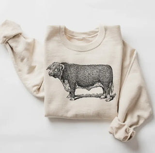 Cream crewneck sweatshirt featuring a vintage black engraving illustration of a Hereford bull on chest.