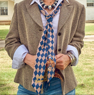 Blue and tan argyle patterned western scarf tied loosely, featuring rodeo cowboy graphic and "Gettin' Western" text.