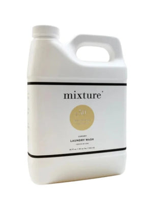 White 64oz jug of Mixture Luxury Laundry Wash No. 50 Egyptian Cotton with gold label detailing.