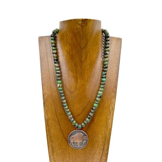 Green turquoise rondelle beaded necklace with copper buffalo coin pendant displayed on wooden bust