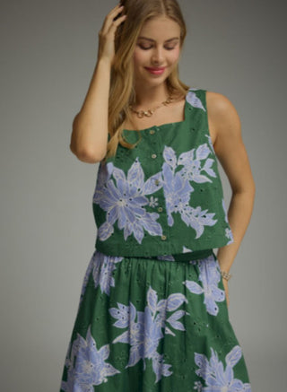 Green botanical floral print sleeveless square neck eyelet top with blue and white flower details.