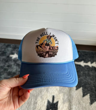 Blue and white trucker hat featuring "The Hell I Won't" text with vintage cowgirl graphic design.