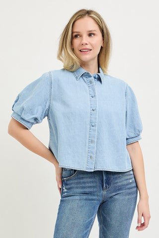 Light blue cropped denim button-up shirt with puff short sleeves and classic collar.