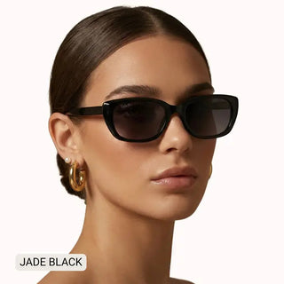 Woman wearing Jade Black small cat eye polarized sunglasses with sleek black frames and dark gradient lenses.